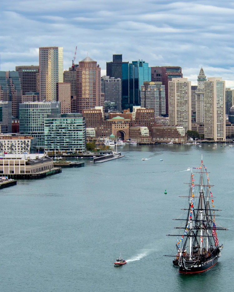 Boston skyline with tall ship in the harbor