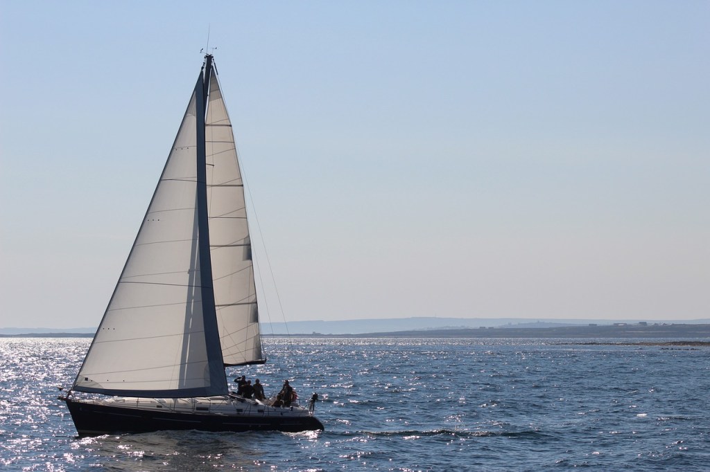 Sailboat off of Venice Beach against a blue sky
