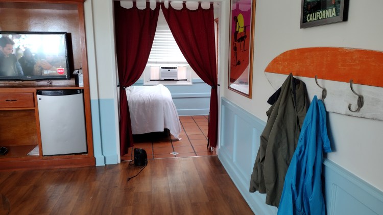 hotel room with surfboard coat hanger