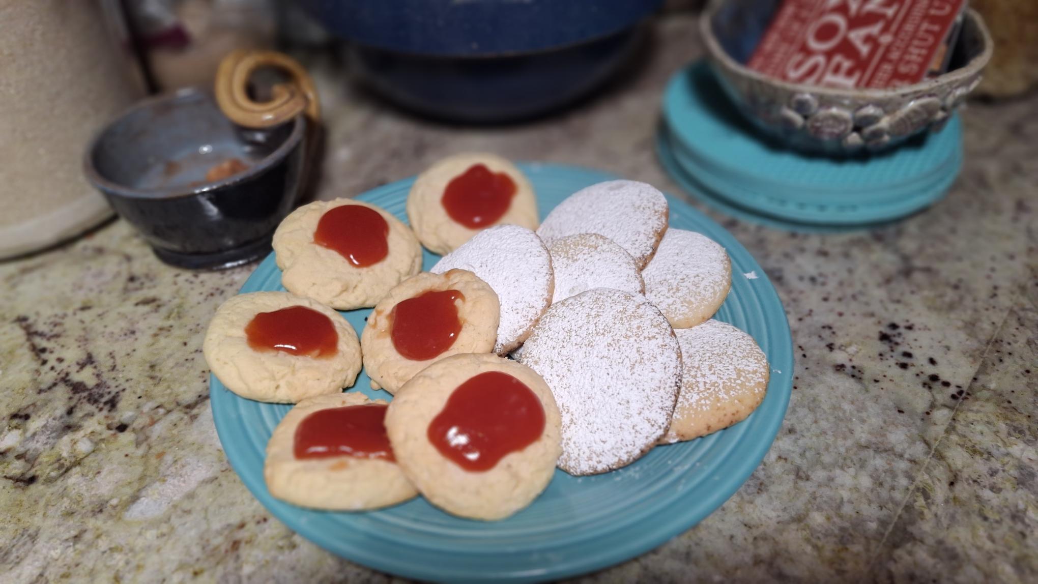 Plate of cookies - powdered sugar covered and guava jam cookies