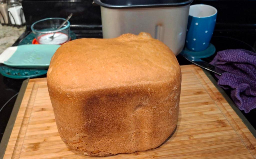 Loaf of fresh bread on bread board